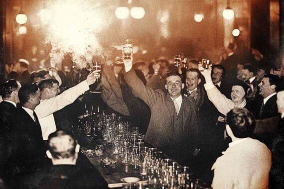 Image from the 1930s of folks celebrating in a bar Image from the 1930s of folks celebrating in a bar