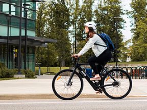 Image of a woman riding a bike.