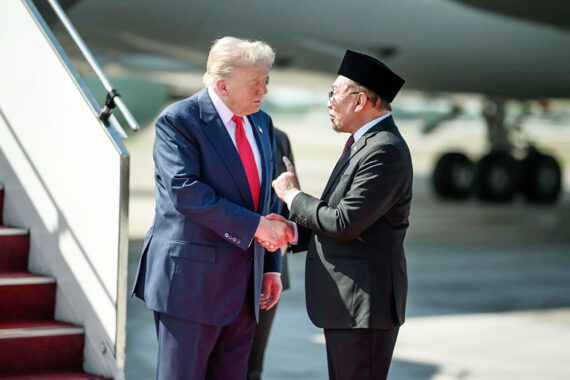 Photo of Donald Trump and Anwar Ibrahim shaking hands