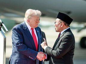 Donald Trump and Anwar Ibrahim shaking hands