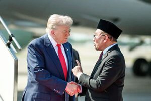 Donald Trump and Anwar Ibrahim shaking hands