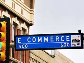 Photo of a street sign reading "E Commerce."