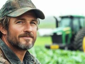 Male farmer in a field of crops