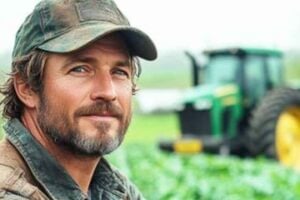 Male farmer in a field of crops