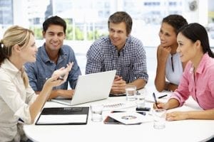 Team members sitting around a table