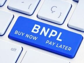 Letters "BNPL" on the return key of a keyboard