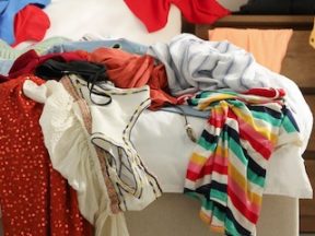 Photos of clothes piled on a bed