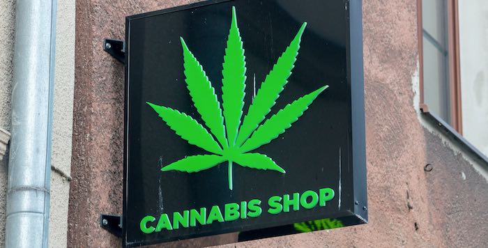 Photo of a retail sign stating "Cannabis Shop" Photo of a retail sign stating "Cannabis Shop"