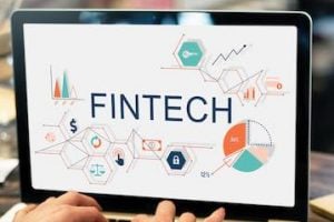 Laptop computer with the words "Fintech" on the screen