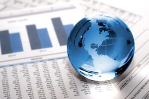 Illustration of a globe on top of printed graph