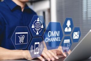Image of a laptop with omnichannel digital concepts above it