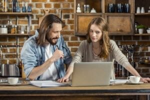 Photo of a male owner and a female owner in a retail setting