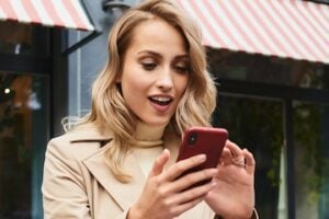 Female shopper looking at her smartphone