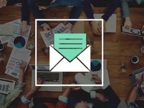 Image of an envelope on top of a photo of workers at a desk