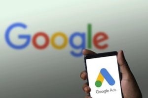 Google logo on a whiteboard and on a smartphone screen