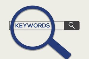 Illustration of the word "Keywords" behind a magnifying glass