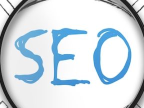 Illustration of "SEO" text behind a magnifying glass