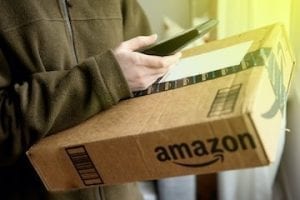 Delivery driver with an Amazon box