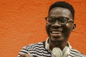 Image from NIQ of a male wearing headphones