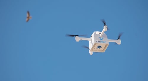 Photo of a SkyDrop drone in flight.
