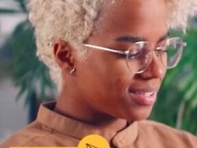 Screenshot from Adobe Experience Cloud of a female holding a computer tablet