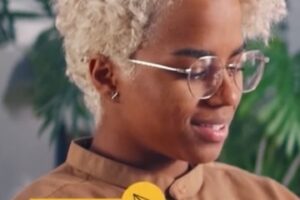 Screenshot from Adobe Experience Cloud of a female holding a computer tablet