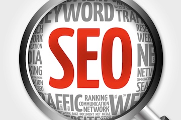 Word cloud for "SEO" behind a magnifying glass