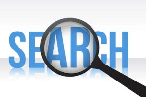 Magnifying glass above the word "Search"