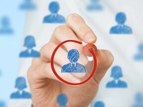 Illustration of a single isolated person among a group of many