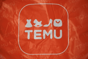 Photo of an orange Temu bag with the logo